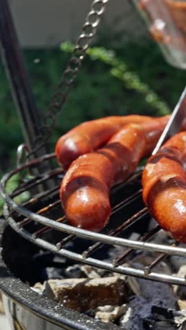 Enjoying Delicious and Flavorful Sausages Cooked on the Grill for an Amazing BBQ Experience