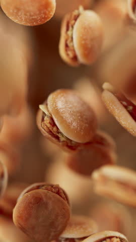 Animation of a group of burgers. Many burgers slowly rotate in the background in space. Vertical composition. Defocus. Close-up.