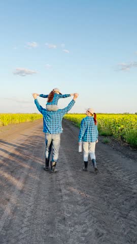 walk to remember, loving family bond, life in the countryside, father s strong support, laughter under blue skies, sunflower fields in bloom, golden hour glow, pastoral landscape, footprints in dirt