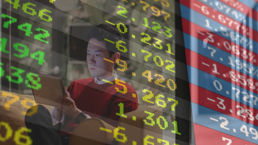 Home-based investor tapping laptop on couch and watching stock ticker overlay updating market data. Financial, technology, digital, trading, analysis, workspace, modern - Powered by Shutterstock - Get 15% off with code: PIKWIZARD15