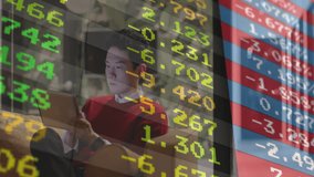 Home-based investor tapping laptop on couch and watching stock ticker overlay updating market data. Financial, technology, digital, trading, analysis, workspace, modern - Powered by Shutterstock - Get 15% off with code: PIKWIZARD15