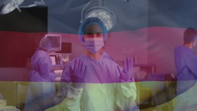 Female surgeon raising gloved hands in OR German flag shifting to US flag uniting medical teams. Medical, teamwork, collaborative, professional, sterile, innovation, healthcare - Powered by Shutterstock - Get 15% off with code: PIKWIZARD15