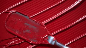 Red lipstick smeared in elegant, soft strokes texture. Red lipstick texture smeared background. Close-up texture ideal for use as background in beauty, cosmetic promotions, or product presentations. - Powered by Shutterstock - Get 15% off with code: PIKWIZARD15