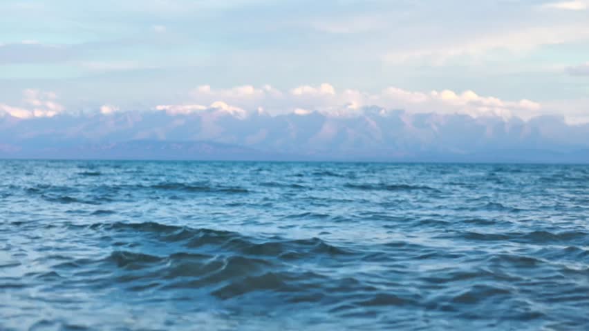 Lake Issyk-Kul Shoreline in Summer – Scenic View with Mountains and Clouds, Tamchy, Kyrgyzstan