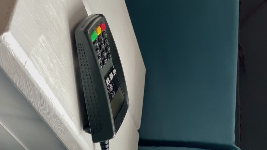 payment terminal. credit card. vertical video. slow motion. high quality 4K footage.