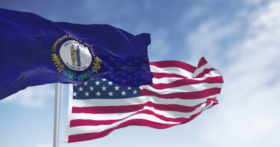 Kentucky state flag and the American flag waving in the wind on a clear day. Southeastern state of the United States. Seamless 3d render animation. Slow motion loop. Selective focus