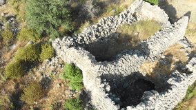 Stunning aerial drone footage reveals the haunting beauty of an abandoned ghost town nestled in Lebanon's majestic mountains.Captures the eerie atmosphere of forgotten stone houses and overgrown paths - Powered by Shutterstock - Get 15% off with code: PIKWIZARD15