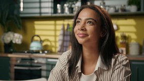 Thinking dreaming girl smiling American Latina woman gen z student teenager glad happy smiling freelancer businesswoman at home kitchen think contemplate looking at window future planning dreams idea - Powered by Shutterstock - Get 15% off with code: PIKWIZARD15