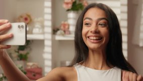 Arabian woman beauty blogger record video mobile phone influencer stylist smiling at home bathroom skin hair care blog morning beautiful girl happy teen using smartphone selfie social media fashion - Powered by Shutterstock - Get 15% off with code: PIKWIZARD15