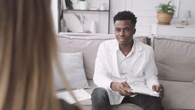 Healthcare and modern medicine, woman consulting with professional therapist. African american male doctor talking with blond female patient in medical office in clinic, strategy of curing, physician - Powered by Shutterstock - Get 15% off with code: PIKWIZARD15