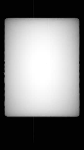Vertical Vintage Film Frame with White Glow and Black Border. Empty Retro Frame with Subtle Grain and Soft Edges. Classic 16mm Look with Film Strip Texture and Light Vignette. Vertical Video. FL0136
