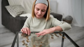 Cute Little Girl Counts Coin Money On A Glass Table Demonstrating The Concept Of Financial Literacy From Childhood - Powered by Shutterstock - Get 15% off with code: PIKWIZARD15