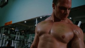 Man gripping dumbbell and performing bicep curl at gym, displaying animated strength metrics. Muscle, strength, fitness, workout, determination, training, gym - Powered by Shutterstock - Get 15% off with code: PIKWIZARD15