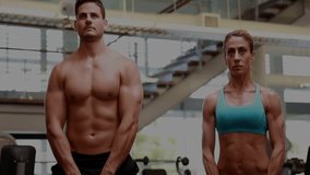 Fitness duo lifting kettlebells in upright rows with overlay charts highlighting muscle activation. Strength, training, biomechanics, muscle, weightlifting, athletic, performance - Powered by Shutterstock - Get 15% off with code: PIKWIZARD15