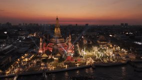 Wat arun temple glowing with vibrant festival illumination, Aerial View, Bangkok, Thailand - Powered by Shutterstock - Get 15% off with code: PIKWIZARD15