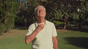 Video of Senior man wipes sweat from face and neck with a tissue in a park during a hot summer day - Powered by Shutterstock - Get 15% off with code: PIKWIZARD15