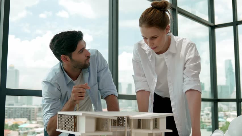 Skilled architect engineer team discussion about house model construction. Successful interior design brainstorming, sharing, talking about architectural design. Creative design. Tracery - Powered by Shutterstock - Get 15% off with code: PIKWIZARD15
