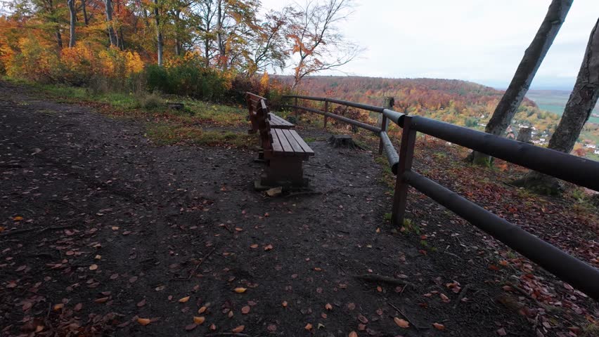 A beautiful Scenic Overlook featuring Benches surrounded by vibrant Autumn Foliage