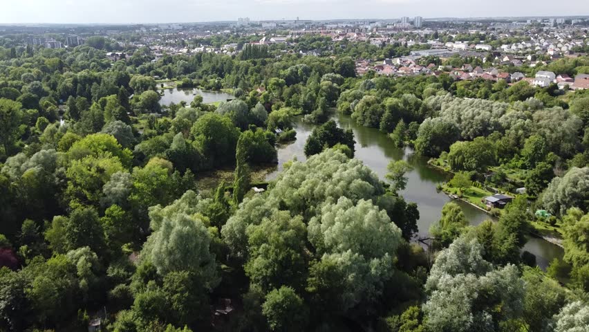 Aerial view of the Hortillonnages of Amiens made of several islands covered with gardens sheds and plantations in a swampy area of the river Somme in Picardie, France
