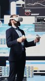 Vertical Video Modern businessman employs virtual reality headset in a digital environment focused on performance metrics, strategic planning through technology and analytics. Firm forecasting. Camera - Powered by Shutterstock - Get 15% off with code: PIKWIZARD15