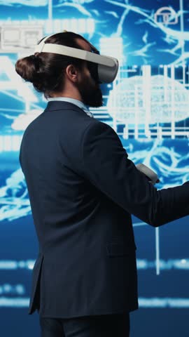 Vertical Video Business IT expert employing vr glasses and artificial intelligence brain, working on data visualization cybernetics within interface for machine learning. High tech gadget for