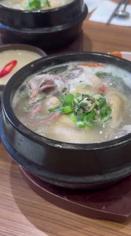 Ginseng chicken soup in Busan, South Korea, a chicken soup that is helpful for good health, is being served piping hot