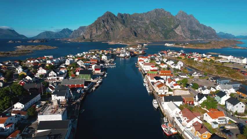Aerial view of Henningsvær town surrounded by sea and rocky islands on Lofoten, northern Norway
