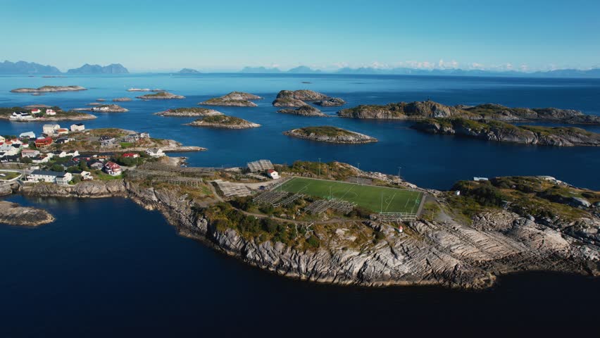 Famous football pitch in Henningsvær. Island village with ocean and cliff background. Lofoten, Norway