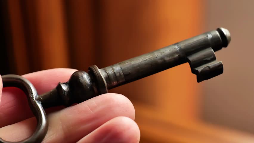 Key in the door.Antique key in hand. Secrets and mysteries atmosphere. 4k footage
