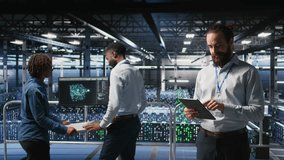 Technicians on data center platform using devices to monitor neural network LLM visualization. Industrial server hub engineering team overseeing rigs powering machine learning processes, camera A - Powered by Shutterstock - Get 15% off with code: PIKWIZARD15