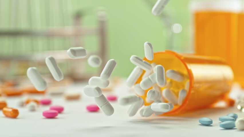 Super Slow Motion of Falling Medicine Dose with White Pills at 1000fps. Pharmacy concept.