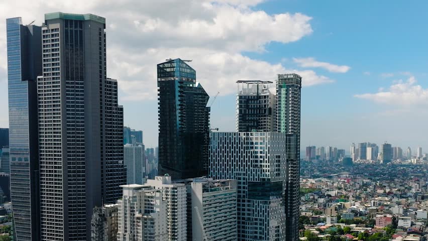 Makati City with skyscrapers and high rise towers. Metro Manila, Philippines.