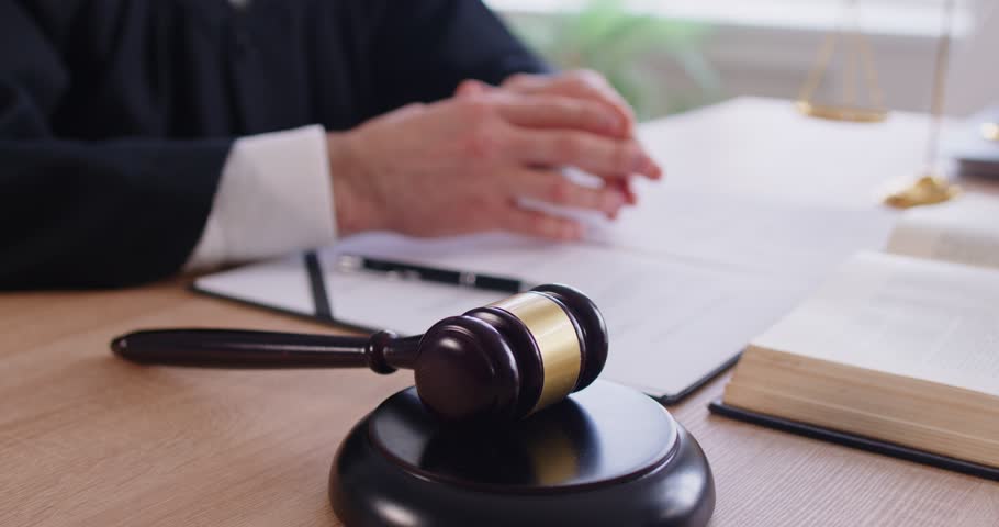 Judge talking, making speech, gavel wooden hammer bangs to sentence in court of law, accuse guilty, proclamation, passes judgement, hitting on table to get attention, punctuate rulings final decision 