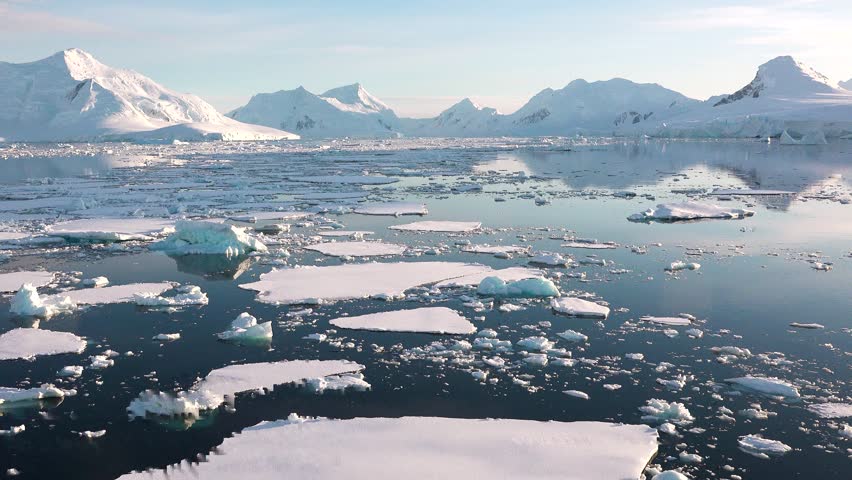 Melting icebergs and glaciers in polar regions highlight the impact of global warming on the environment. Large areas of water expose the consequences of climate change.