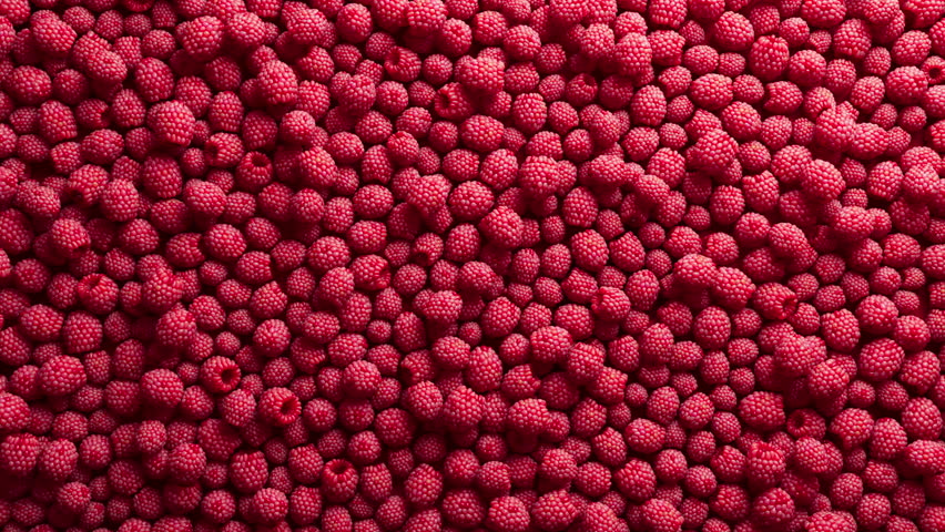 Colorful background covered with raspberries. Ripe berries for wallpaper. Patterns with fruits. Close-up. Horizontal composition.