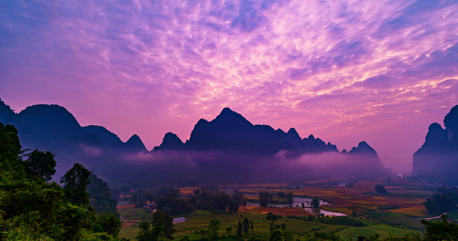 Timelapse wide angle view of landscape with rice field at Phong Nam village in Trung Khanh,Cao Bang province,Northern Vietnam,Timelapse sunrise sky and fog over mountains
