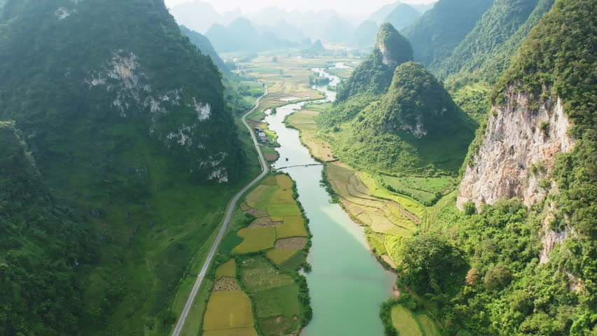 Aerial view wide angle of landscape with rice field at Phong Nam village in Trung Khanh,Cao Bang province,Northern Vietnam,Beautiful sunrise sky and fog over mountains