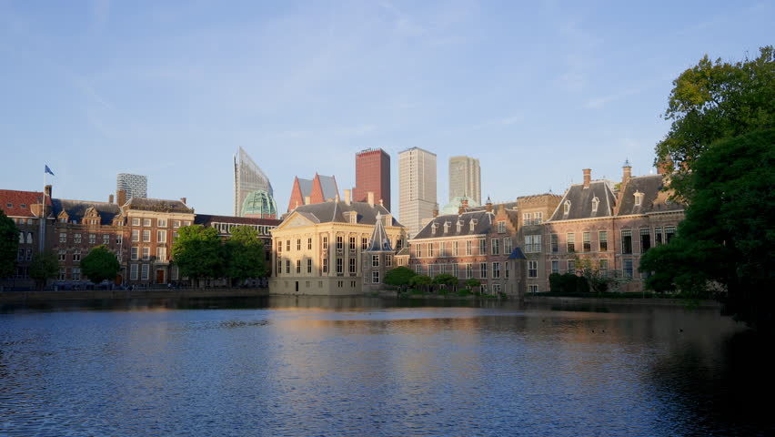 Hofvijver, the Dutch parliament building at sunset in The Hague, The Netherlands.