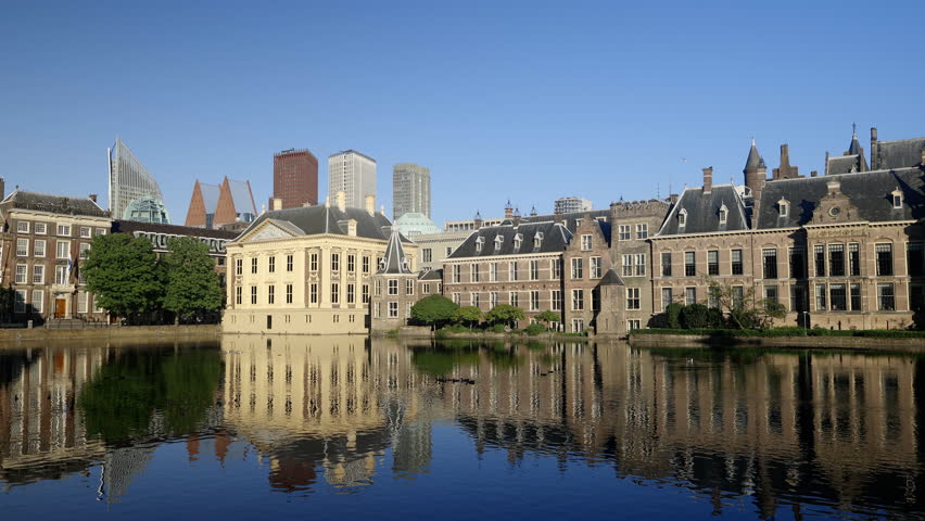 Hofvijver, the Dutch parliament building at sunset in The Hague, The Netherlands.