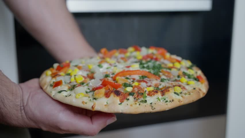 A fresh, homemade vegetable pizza topped with colorful ingredients, perfect for any meal or occasion. slow motion