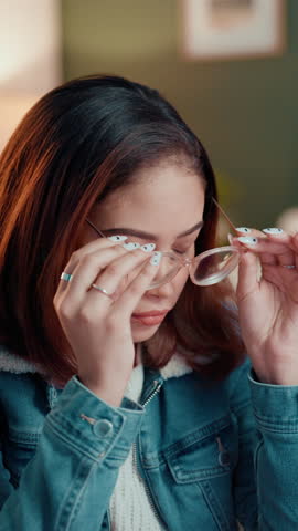 Headache, stress and woman with glasses in home for eye strain, brain fog or pressure of unemployment. Dizzy, fatigue and tired female person with migraine, vertigo or exhaustion for job hunting.