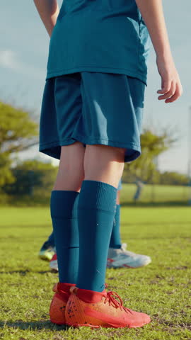 Free kick, children or football player with goal for winning at game and match in kids tournament. Sports, exercise and back of soccer athlete shooting ball in net at practice on field at stadium