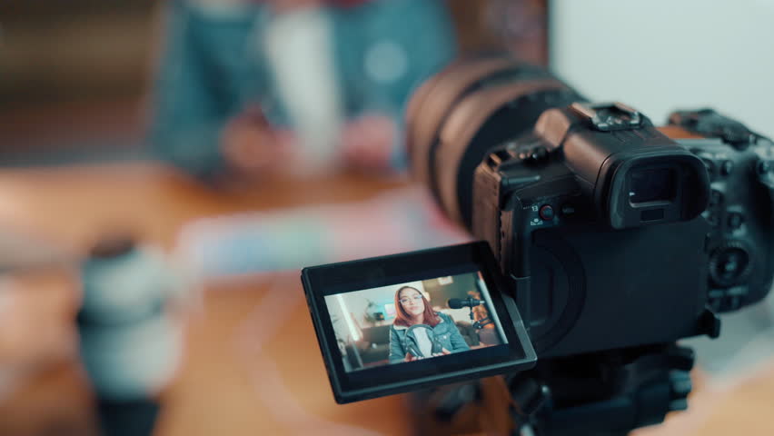 Woman, video camera and screen with online tutorial for content creation or streaming tips at home. Closeup, female person or influencer with live recording or technology display for digital course