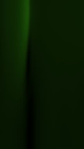 Abstract green wallpaper of blurred green light on a dark background. Suitable for vertical backgrounds, presentations, banners, websites, and design projects.