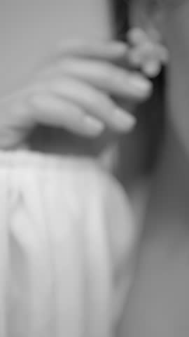 Elegant Woman in Flowing White Attire Exudes Confidence and Grace in a Serene Studio Setting During an Afternoon Photoshoot Celebrating Natural Beauty