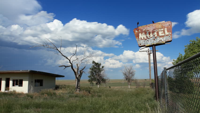 Timelapse of clouds behind an old, creepy, abandoned motel in rural Colorado,