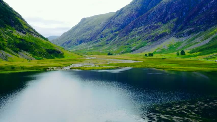 Serene Twilight Scenery with Tranquil Waters, Dramatic Peaks, and Vibrant Sunset Sky Captured in High-Definition Photography, Perfect for Travel, Adventure, Nature, and Landscape Themes