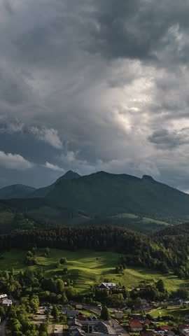 Vertical Timelapse of Storm Clouds Over European Countryside in Spring Nature