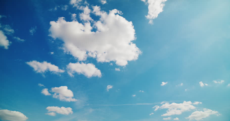 A captivating time-lapse of beautiful clouds moving swiftly against a blue sky during midsummer.