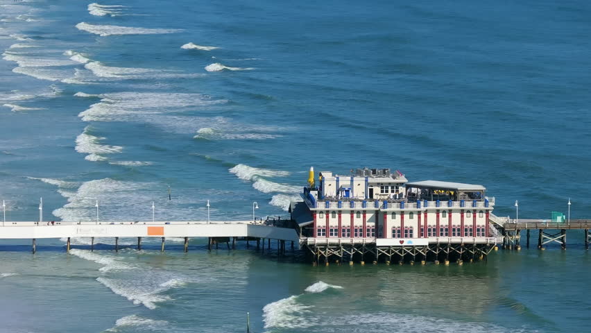 Daytona Beach, Florida. Main Street Pier surrounded by beachfront resorts and residential condos, forming part of the city coastal tourism development.